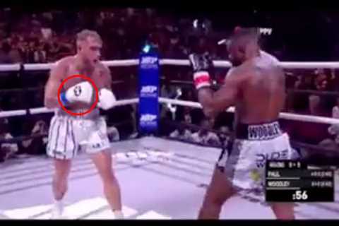 Jake Paul and Tyron Woodley accused of FIXING fight after ‘secret hand signal’ spotted moments..