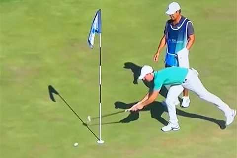 Watch fuming Rory McIlroy throw fan’s remote control golf ball into water before security kick..