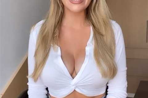 Paige Spiranac stuns in very revealing low-cut shirt as fan jokes ‘that button is doing everything..