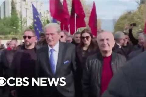 Albanian opposition leader Sali Berisha punched in the face during anti-government protest