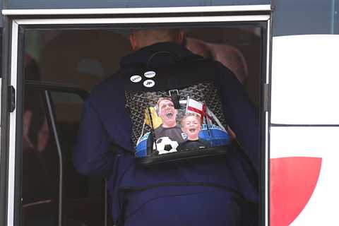 Jordan Pickford boards England team bus with custom family-themed backpack as he leaves Qatar hotel ..