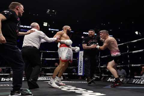 Watch Liam Smith’s coach hold back Chris Eubank Jr as shaken boxer tried to fight on despite being..