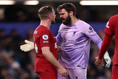 Watch Henderson shoulder charge Alisson in heated clash during Chelsea draw as Liverpool fans all..