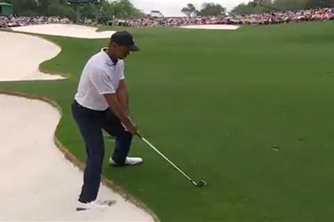 Fans fear for Tiger Woods and claim he’s in pain as very awkward shot leaves him hopping and..