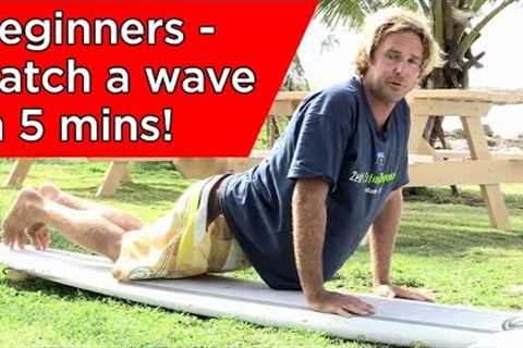 How to stand up on a surfboard