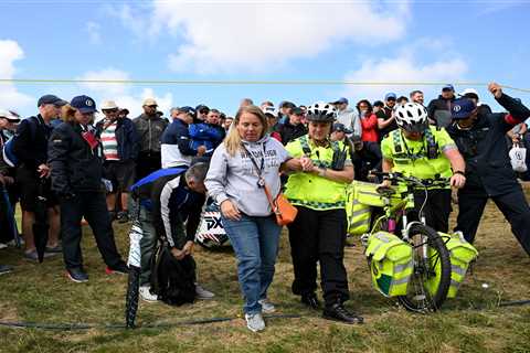 Medics rush to help stricken fan as second supporter is hit by ball at The Open after stray Zach..